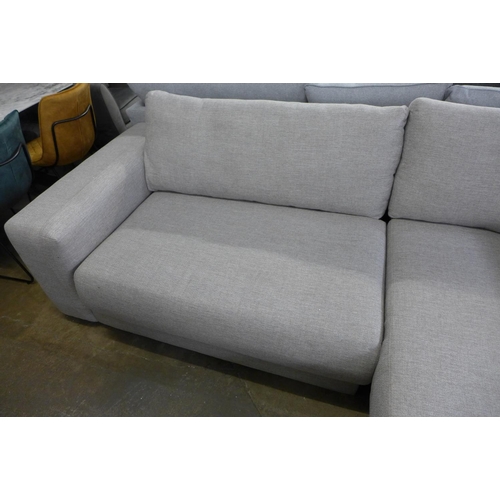 1503 - A grey textured weave four seater sofa/chaise