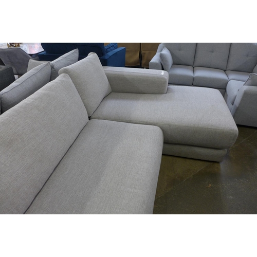 1503 - A grey textured weave four seater sofa/chaise