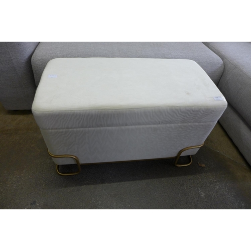 1504 - A cream upholstered storage stool with gold legs