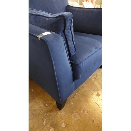 1501 - A navy blue velvet upholstered armchair