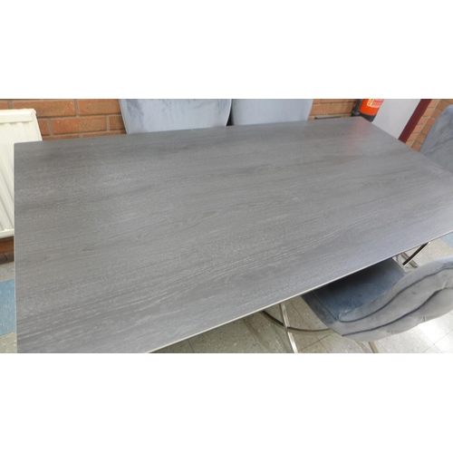 1301 - A grey ceramic top dining table with a set of six Hugo dark grey velvet dining chairs  *This lot is ... 