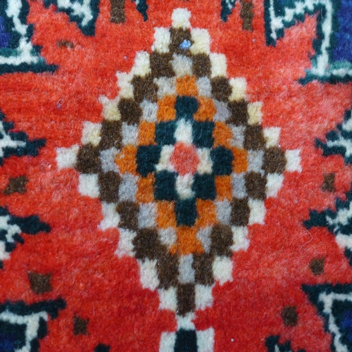 1422 - A thick wool pile, Persian Qashqai tribal runner with bespoke medallion design