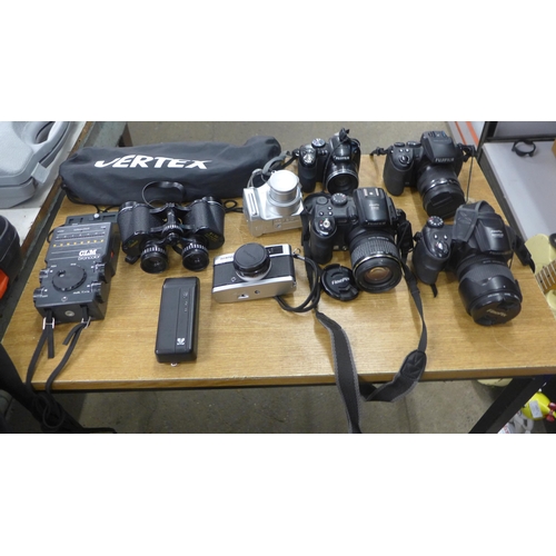 2071 - Camera items; Fuji, Finepix, Olympus and many tripods