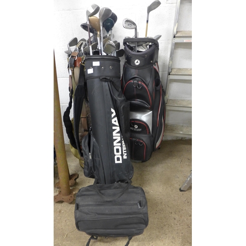 2391 - 3 Golf bags with approx. 30 clubs & solo golf trolley attachment