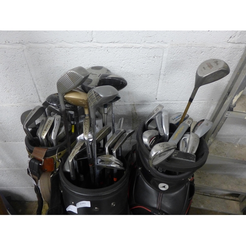 2391 - 3 Golf bags with approx. 30 clubs & solo golf trolley attachment