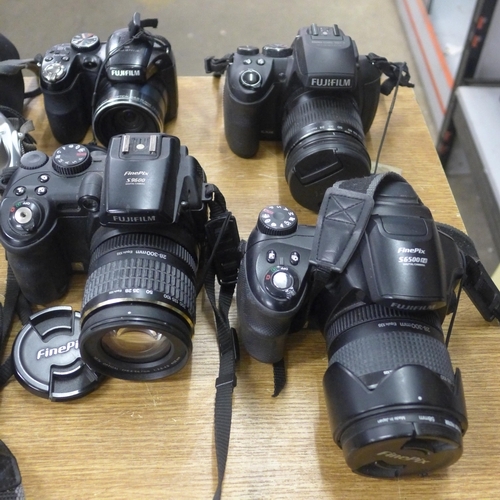 2071 - Camera items; Fuji, Finepix, Olympus and many tripods