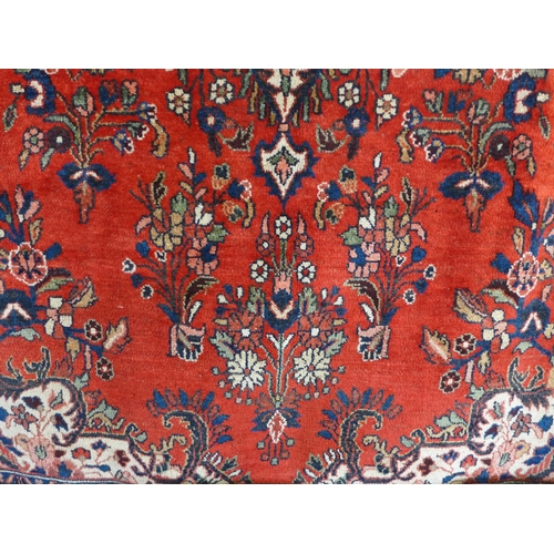 1540 - A washed red ground, full pile, Persian carpet, from Surook region of Iran with traditional floral m... 