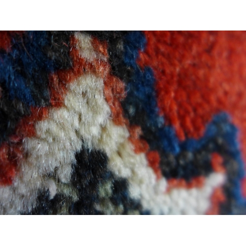 1540 - A washed red ground, full pile, Persian carpet, from Surook region of Iran with traditional floral m... 