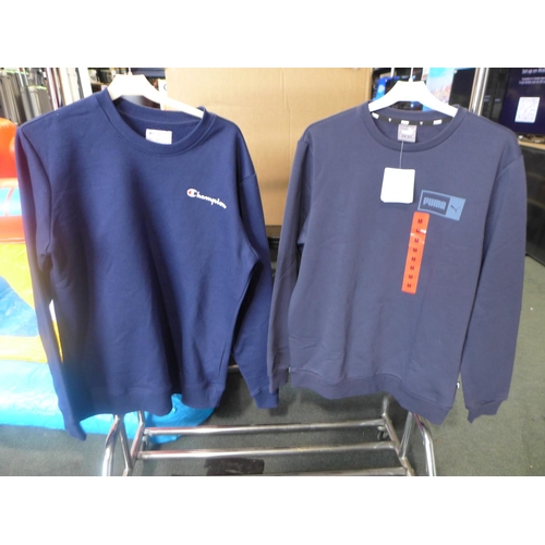 3051 - 2 Men's blue sweatshirts - Champion (S) and Puma (M) * this lot is subject to VAT