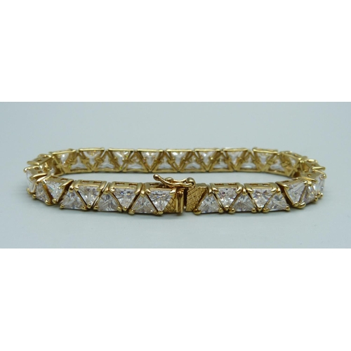 1000 - A silver gilt, simulated diamond line bracelet