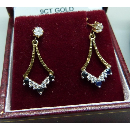 1003 - Two pairs of 9ct gold earrings, garnets and sapphire and white stones