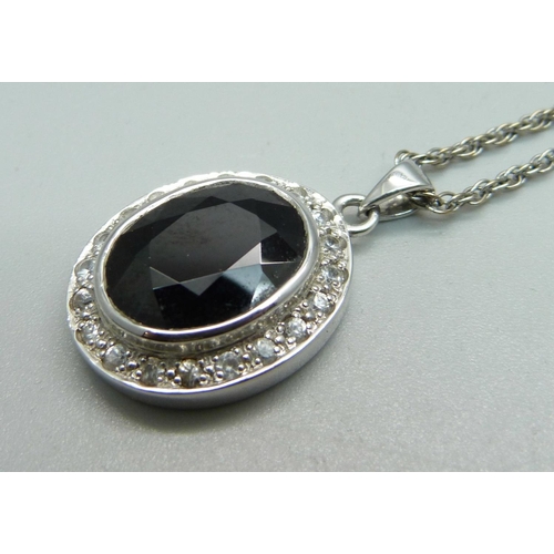 1006 - A 9ct white gold, white stone and onyx pendant on a 9ct white gold chain, total weight 10.1g