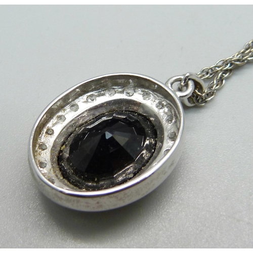 1006 - A 9ct white gold, white stone and onyx pendant on a 9ct white gold chain, total weight 10.1g