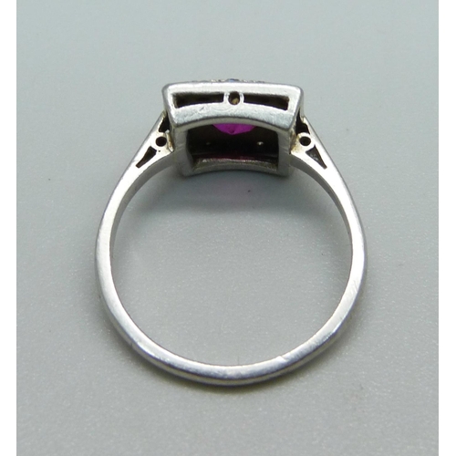 1009 - An Art Deco platinum, diamond and ruby ring, 4.7g, L, ring top 10mm x 10mm, small chip on the ruby