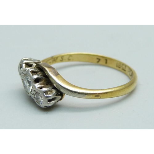 1027 - An 18ct gold and platinum set three stone diamond ring, approximately 0.4ct diamond weight, 2.7g, L,... 