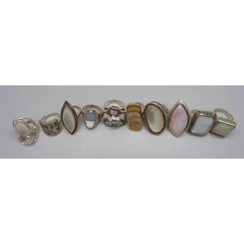 1033 - Ten large 'chunky' silver and mother of pearl rings, 129.39g