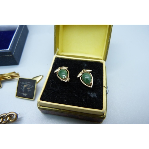 1038 - A pair of jade set earrings, the fasteners marked 14k, a tie pin marked K24 and cufflinks set and a ... 