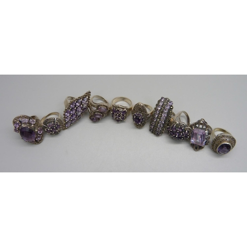 1039 - Ten large 'chunky' silver and amethyst rings, 115.18g