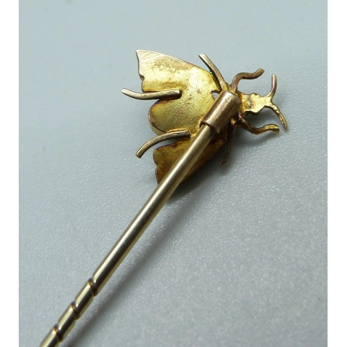 1050 - A chrysoprase and pearl set insect stick pin, (acid tests as high carat gold with 9ct gold pin)