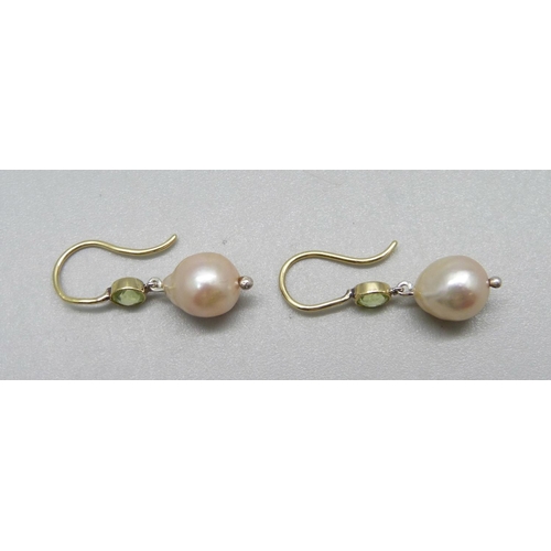 1051 - A pair of peridot and pearl drop earrings (wires test as high carat gold, pearls mounted in silver)