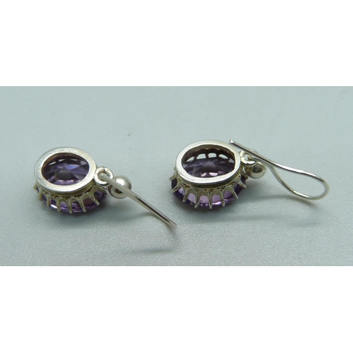 1057 - A pair of silver and amethyst drop earrings