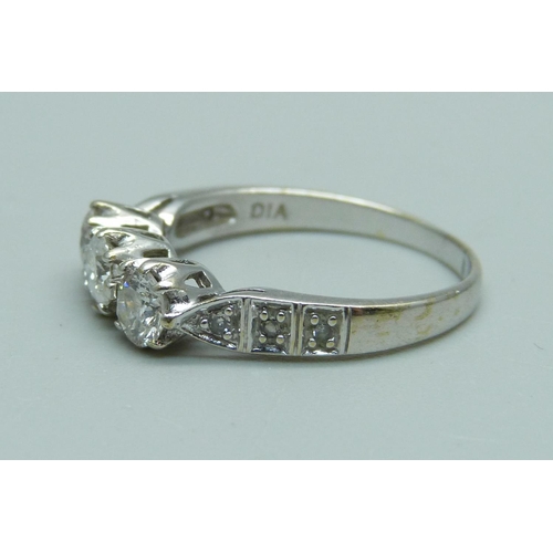 1063 - A 9ct white gold and diamond ring, 2.9g, P