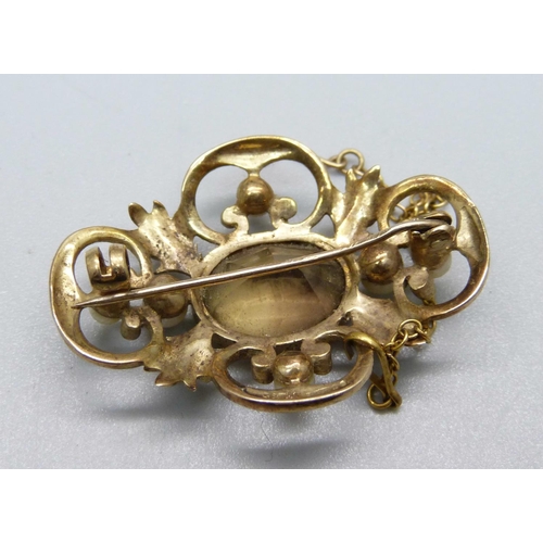 1088 - A 9ct gold, pearl and stone set brooch, 8.1g