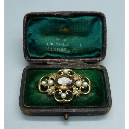 1088 - A 9ct gold, pearl and stone set brooch, 8.1g