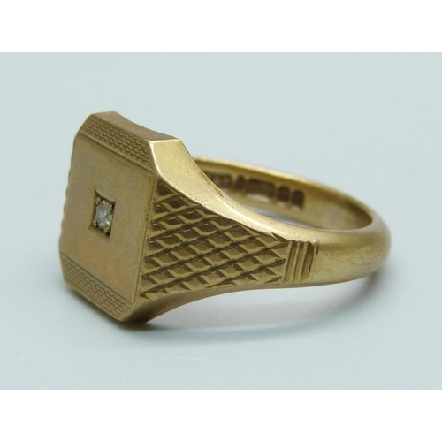 1106 - A 9ct gold signet ring set with a diamond, 9.3g, X