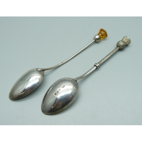 1116 - Two silver spoons with thistle finials, 16g