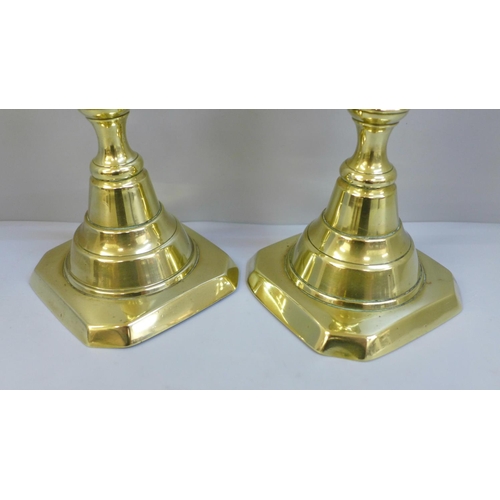 607 - A pair of 19th Century Queen of Diamonds pattern brass candlesticks, 30cm