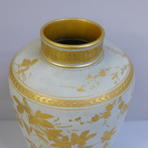 609 - A late 19th Century duck egg blue and gilt Wedgwood vase, decorated with leaves and flowers, 22cm