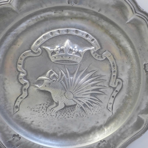 610 - Two French early pewter plates, contoured edges, decorated with crown over a porcupine and a crown o... 