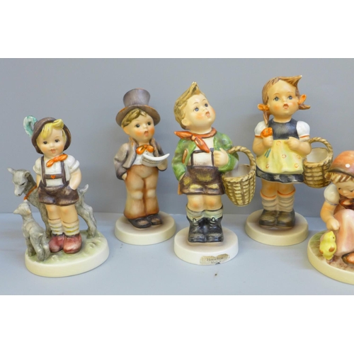 617 - Eight Hummel/Goebel figures, two a/f, small chip to umbrella and to base