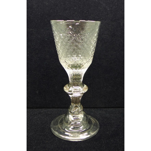 624 - An 18th Century wine glass, circa 1720, with hammered conical bowl over a teared baluster knop stem ... 