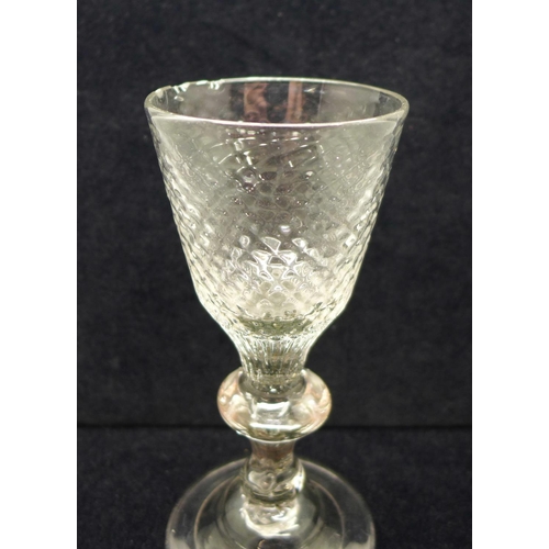 624 - An 18th Century wine glass, circa 1720, with hammered conical bowl over a teared baluster knop stem ... 