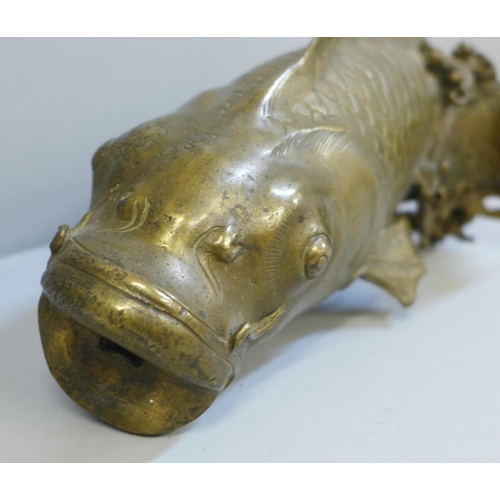 635 - An oriental bronze model of a carp, 23.5cm