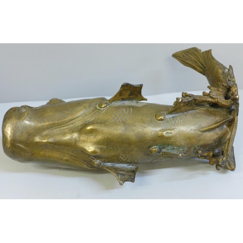 635 - An oriental bronze model of a carp, 23.5cm