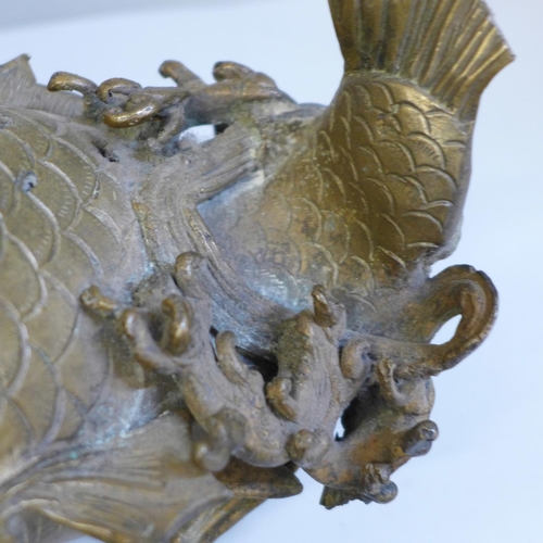 635 - An oriental bronze model of a carp, 23.5cm