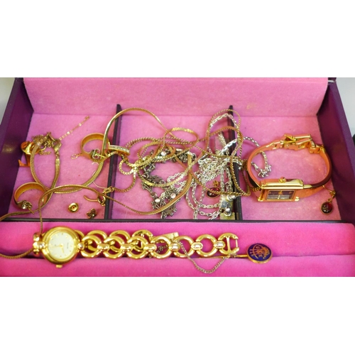 639 - Costume jewellery, a yellow metal wishbone pendant and chain and two lady's wristwatches