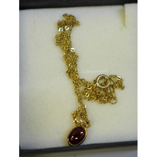 639 - Costume jewellery, a yellow metal wishbone pendant and chain and two lady's wristwatches