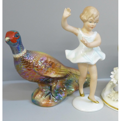 648 - A KSP model of a pheasant, a small German porcelain figure of a dancer, a Staffordshire figure of a ... 