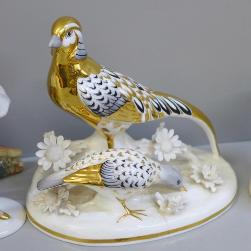 648 - A KSP model of a pheasant, a small German porcelain figure of a dancer, a Staffordshire figure of a ... 