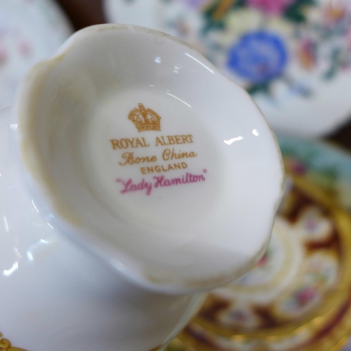 669 - A Royal Albert tea cup and saucer, second, a Royal Albert Lady Hamilton trio, a Lime House Studio cu... 