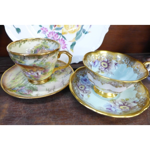 669 - A Royal Albert tea cup and saucer, second, a Royal Albert Lady Hamilton trio, a Lime House Studio cu... 