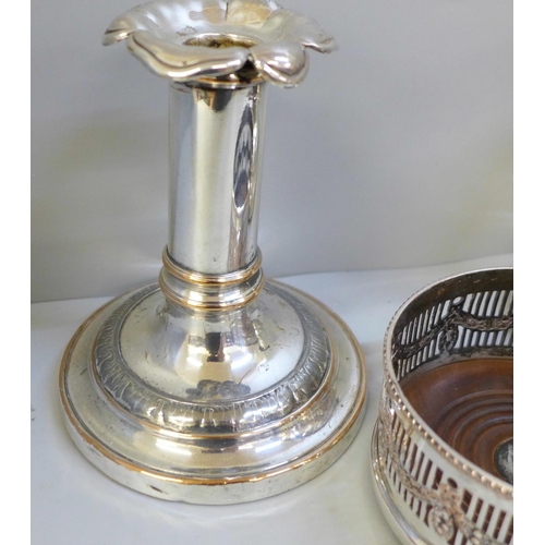 671 - A pair of silver plated candlesticks, a Mappin & Webb egg cruet and wine coaster