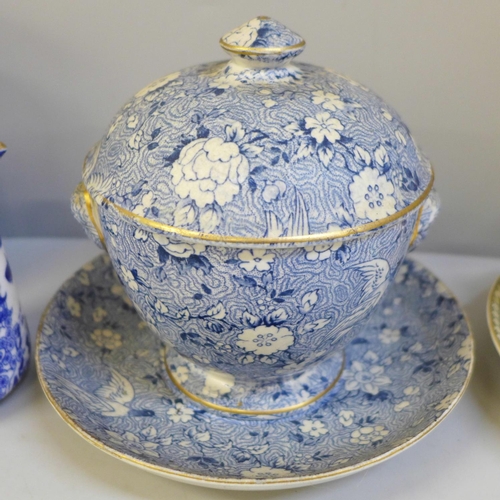 672 - Two Royal Worcester blue and white jugs, one a/f, a God Speed The Plough cup and saucer, chip to rim... 