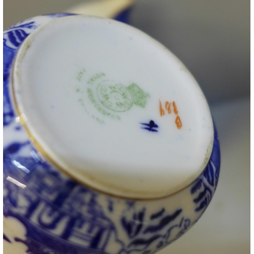 672 - Two Royal Worcester blue and white jugs, one a/f, a God Speed The Plough cup and saucer, chip to rim... 