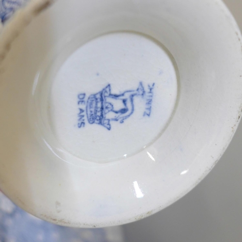 672 - Two Royal Worcester blue and white jugs, one a/f, a God Speed The Plough cup and saucer, chip to rim... 