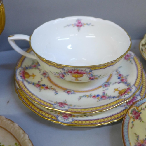 684 - A collection of Royal Worcester porcelain including cups and saucers, trios, sugar pot, pin dishes